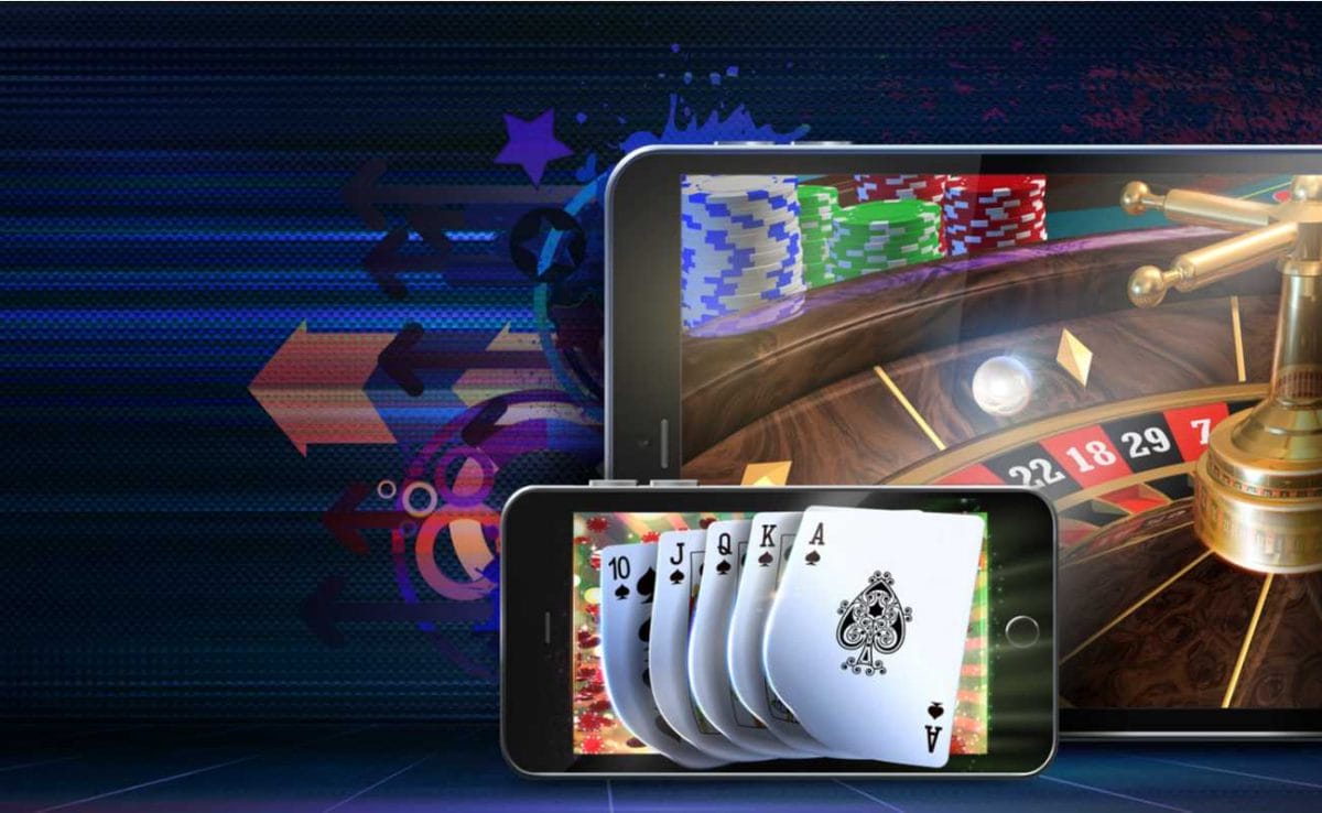 Tablet and iPhone displaying online roulette and poker.