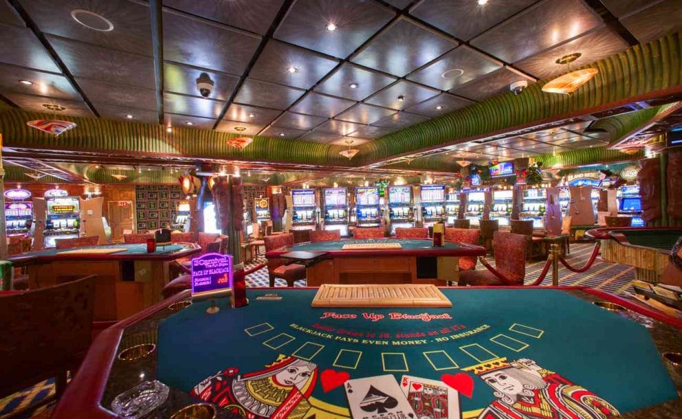 Empty colorful casino with poker tables and slot machines