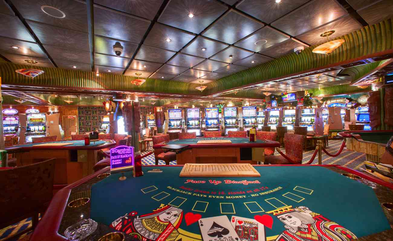Empty colorful casino with poker tables and slot machines