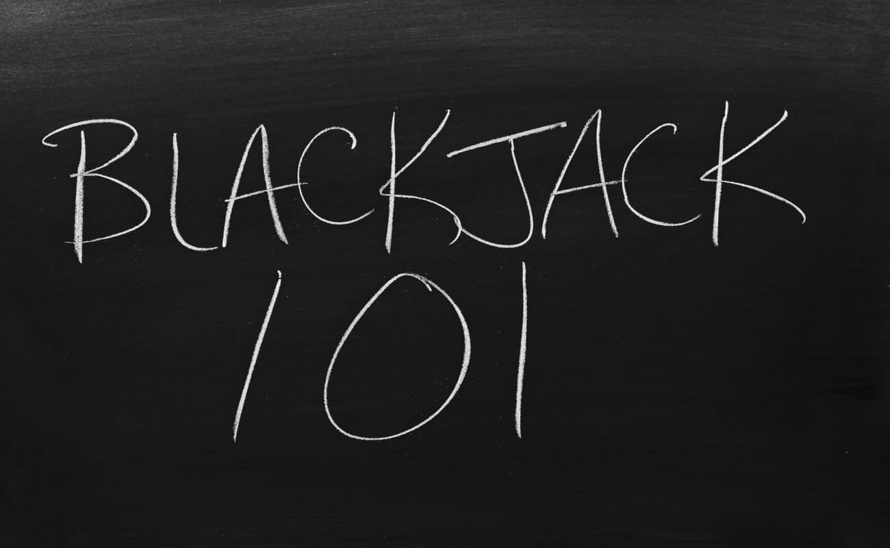 Blackjack 101 written on a blackboard with white chalk