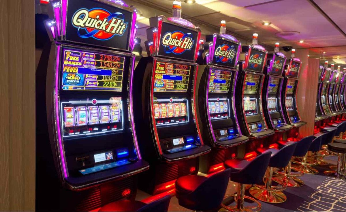 Row of Slot machines in gambling casino 