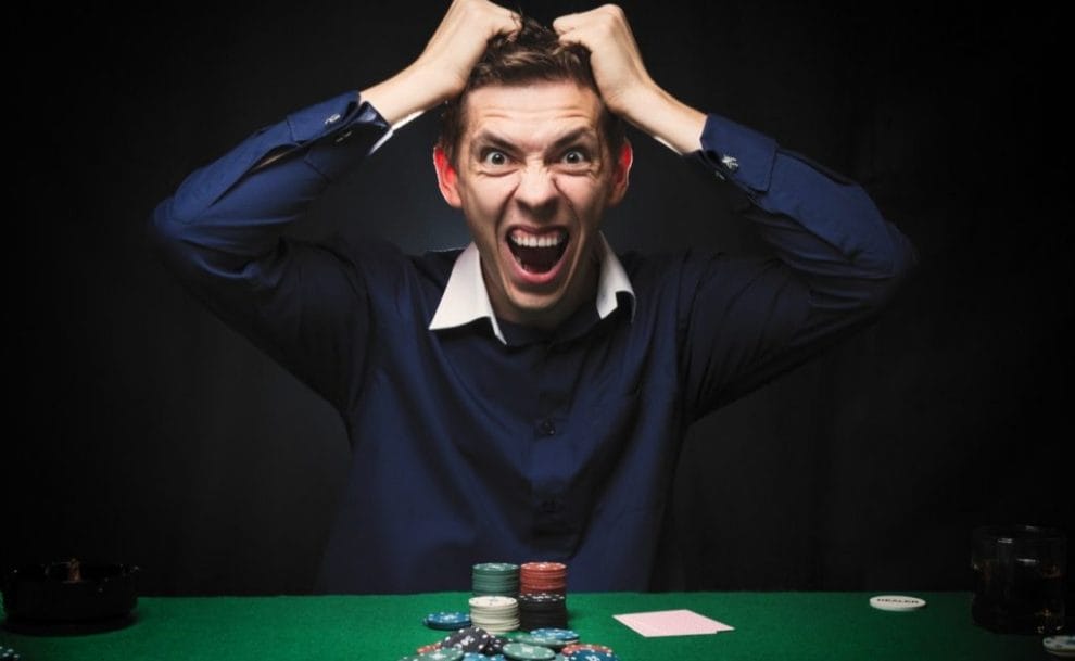 Angry man playing poker