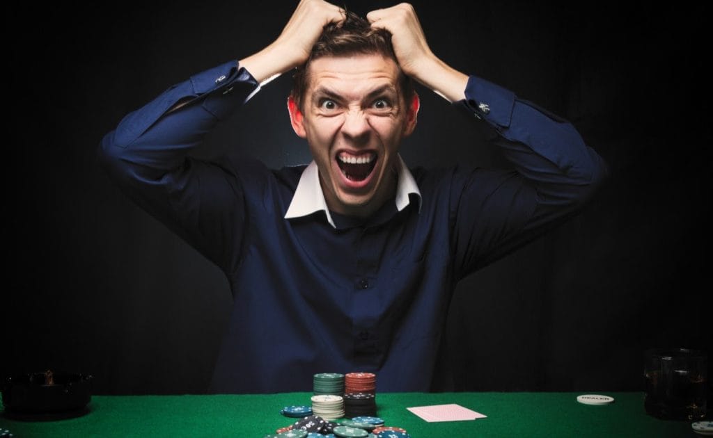 Angry man playing poker