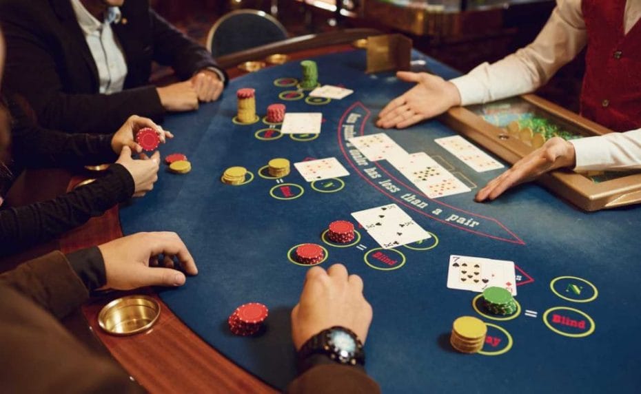 hands at the poker table with poker chips and cards