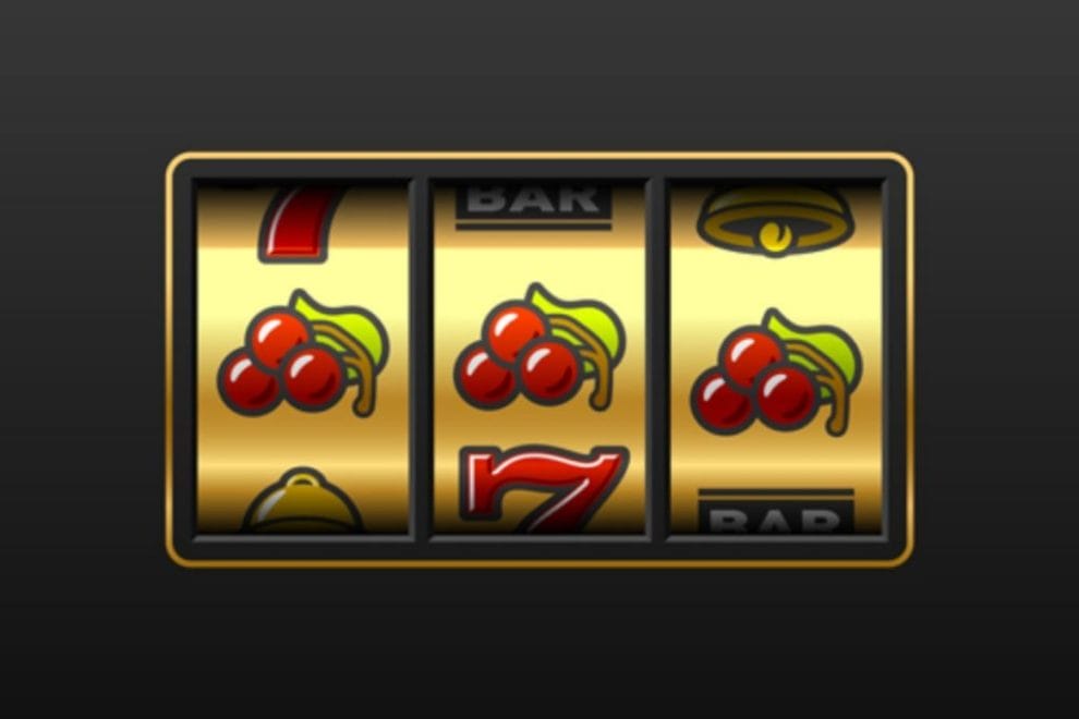 Vintage looking 3-wheel slot machine with three cherries in a row