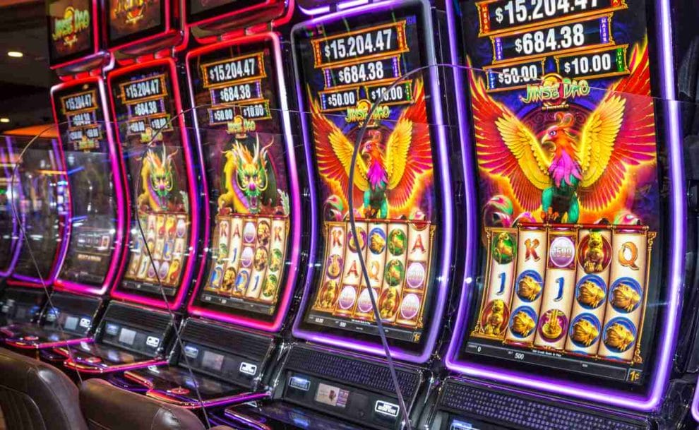 Row of colorful slot machines in a casino