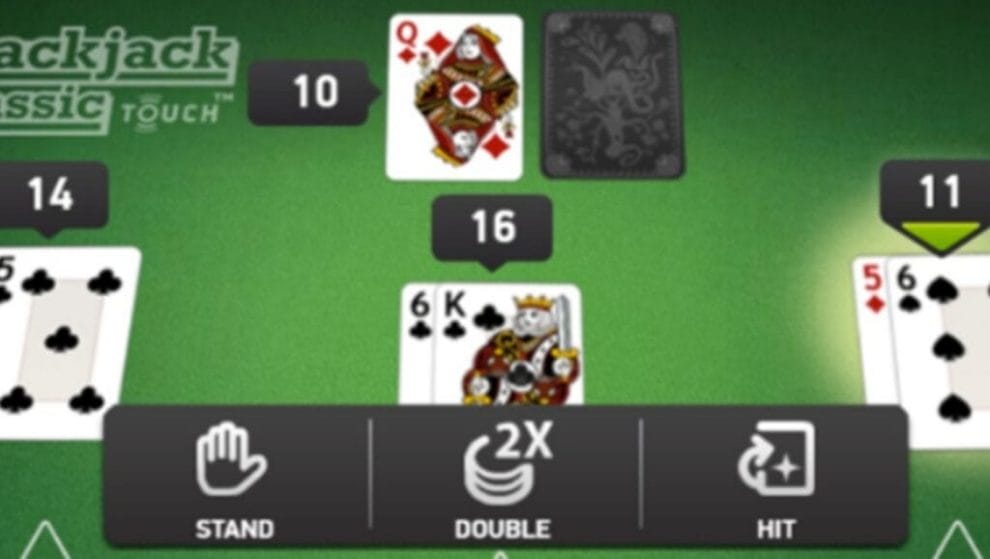 Blackjack Classic Touch with three hands of cards and the dealer’s hand on a green blackjack table.