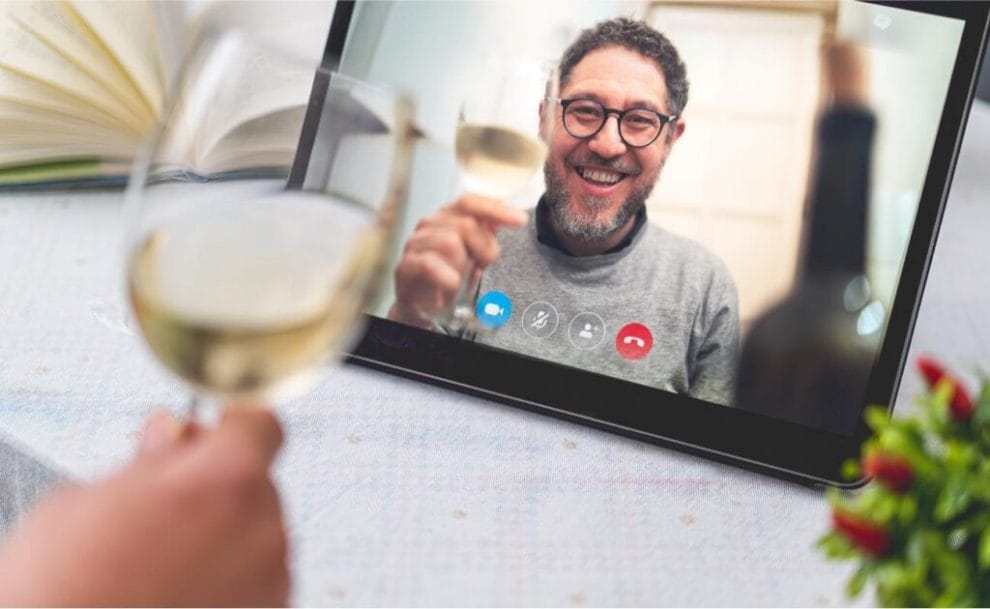 Friends drinking wine via online video call
