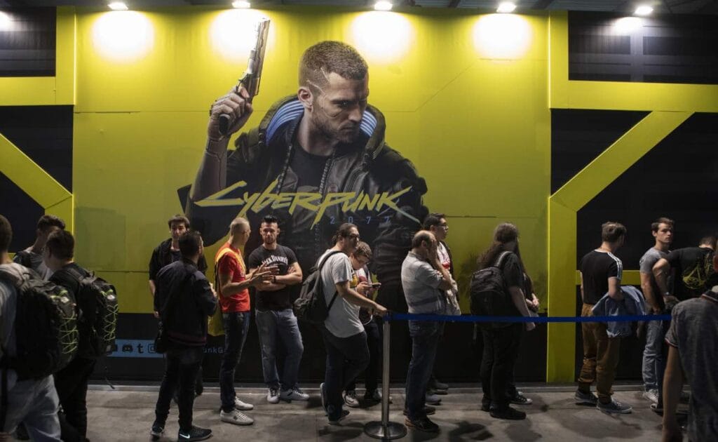 Fairgoers wait in line in front of Cyberpunk 2077's stand during the Milan Games Week September 2019