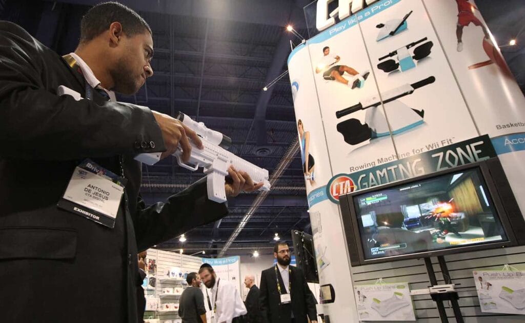 Antonio De Jesus demonstrates the CTA sniper rifle for Nintendo wii during the 2010 International Consumer Electronics Show January 2010
