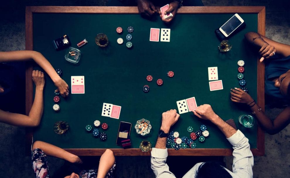 Aerial view of people playing poker at a table