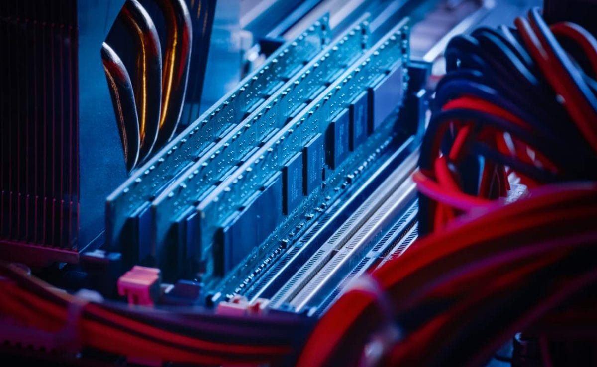 Close-up macro shot of installed RAM memory in computer motherboard slot. Shot in neon colors.