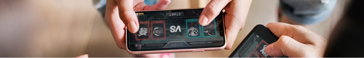 Aerial view of a group of friends playing a game on mobile phone