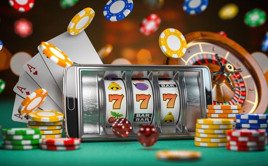 Three orange 7s lined up on a mobile online slots game, with chips, cards and a roulette wheel in the background.