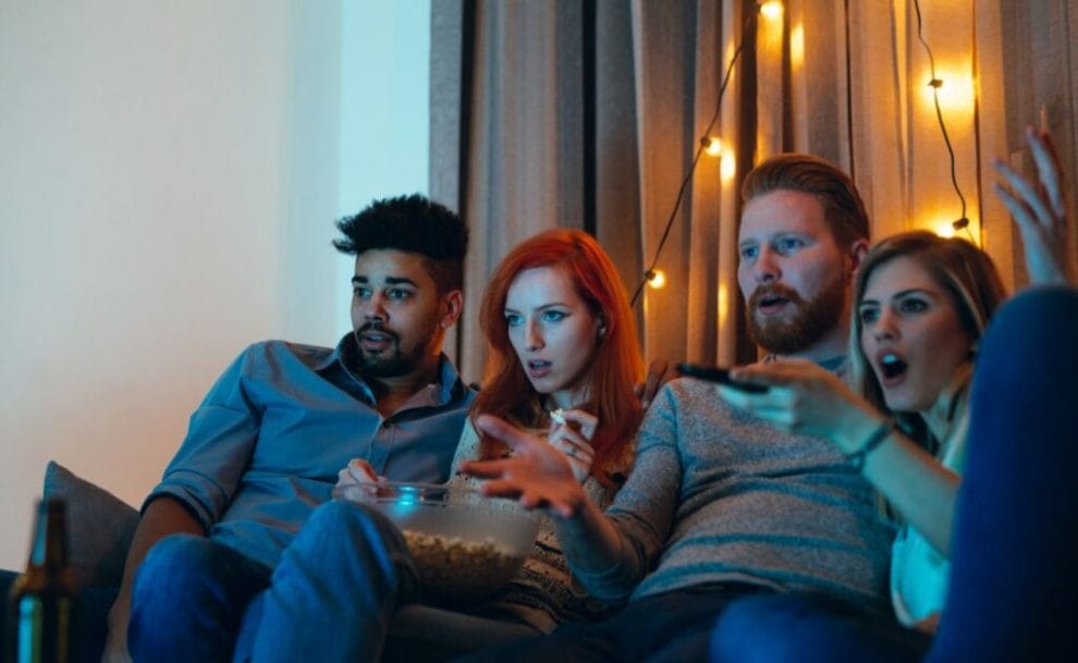 Two couples watching movies.