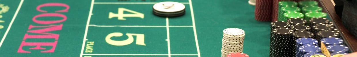 Craps casino table featuring multi-colored chips