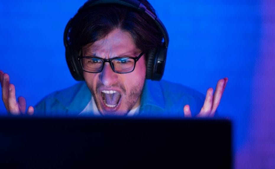 An angry player shouts at his computer screen.