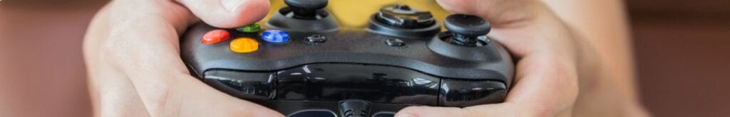A person holds a video game controller.