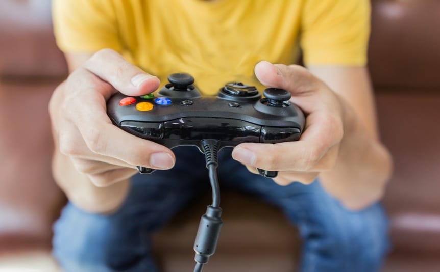 A person holds a video game controller.