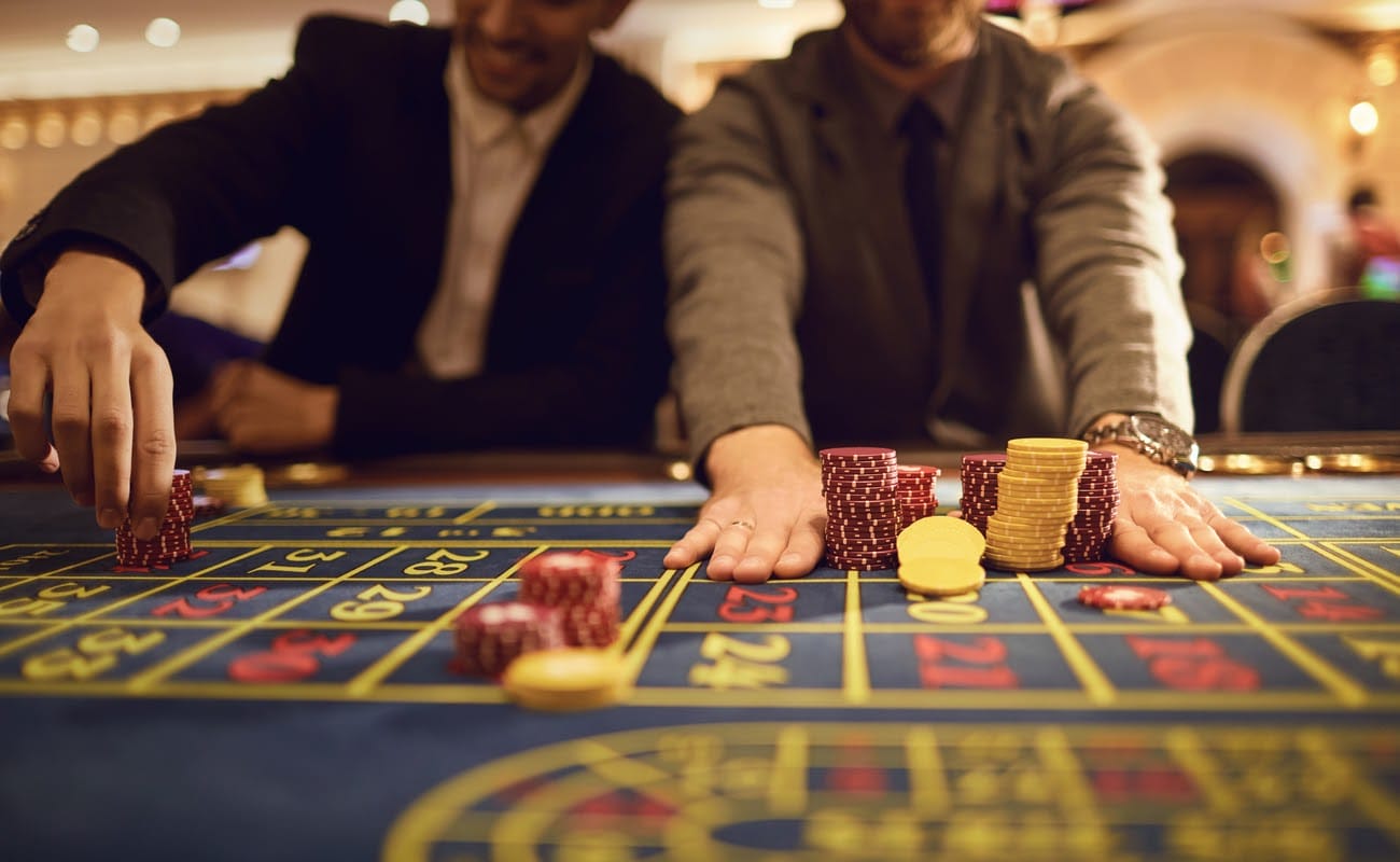 Two men at a casino table.