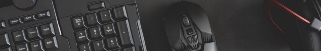 Various pieces of gaming technology, including a keyboard, mouse, and set of headphones.
