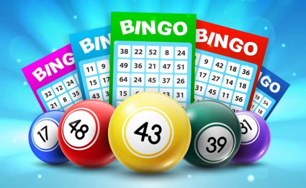 Vector image of bingo balls and 5x5 grid tickets against a blue background.