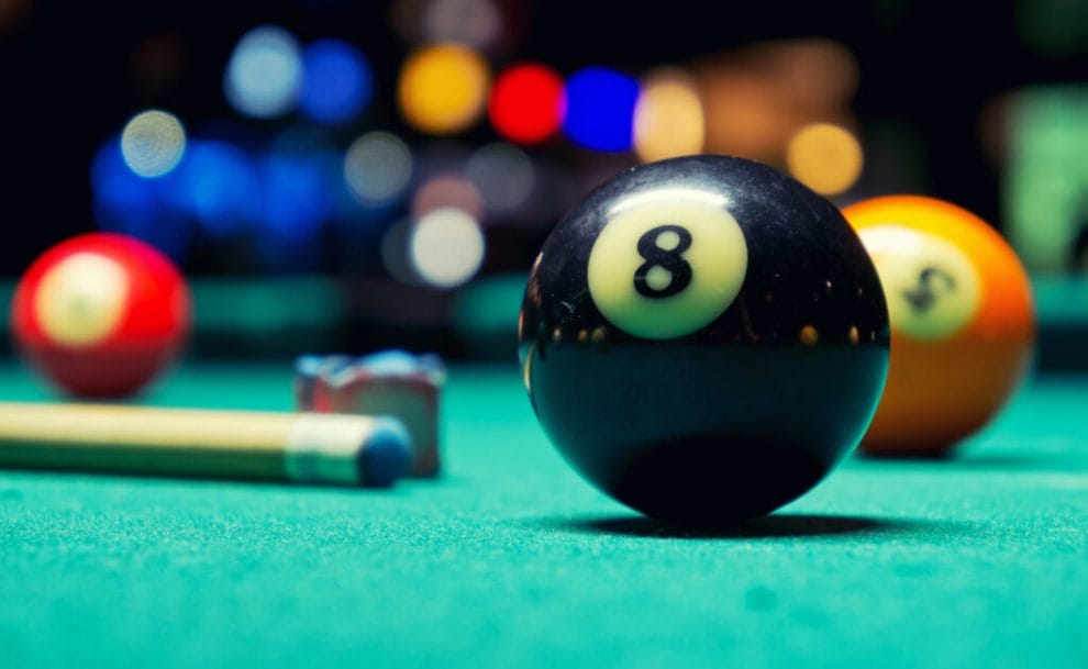 A black eight-ball on a table.