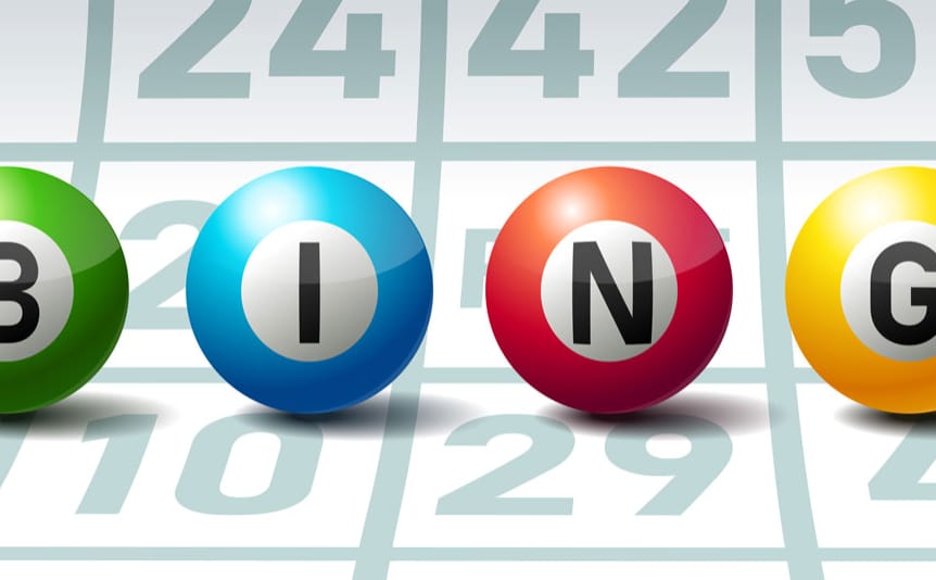 Bingo spelled out on bingo balls against a bingo card.