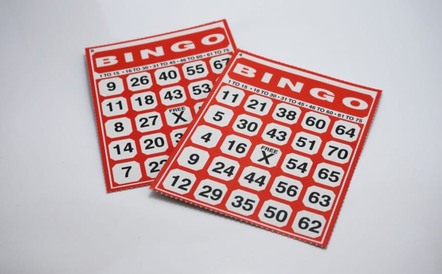 Two new bingo cards lie on a table.