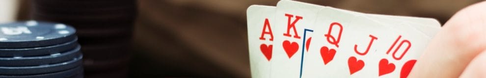 A poker player reveals their hand.