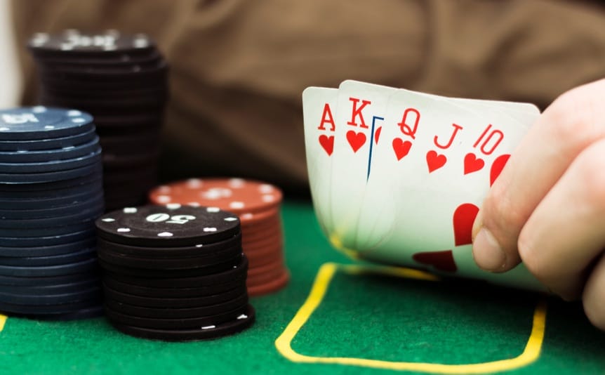 A poker player reveals their hand.