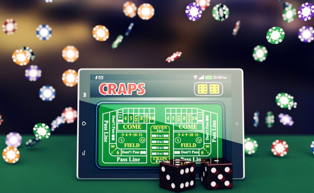 A tablet with a craps game on the screen, dice in front of it, and chips falling through the air in the background.
