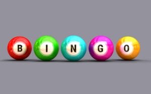 Line of colorful bingo balls spelling out the word, ‘bingo.’