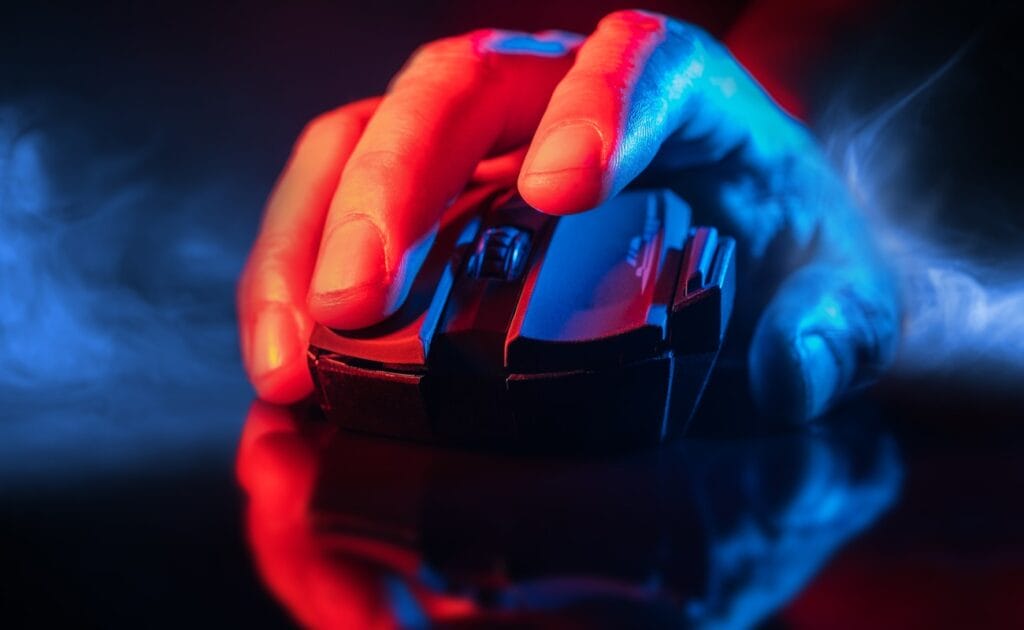 A close-up of a hand holding a gaming mouse.