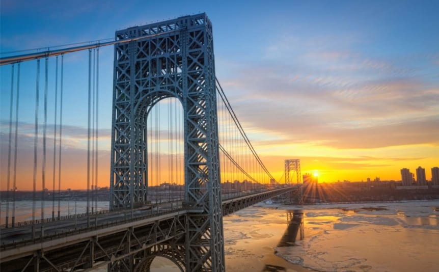 George Washington Bridge from New Jersey with a sunset in the background.