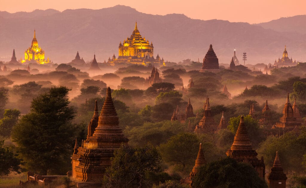 Myanmar’s famous pagodas in the sunrise mist.