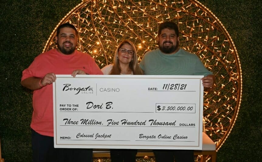 Dori B. with her family and the $3.5M jackpot prize.