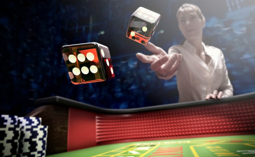 A woman throws dice onto a casino craps table.