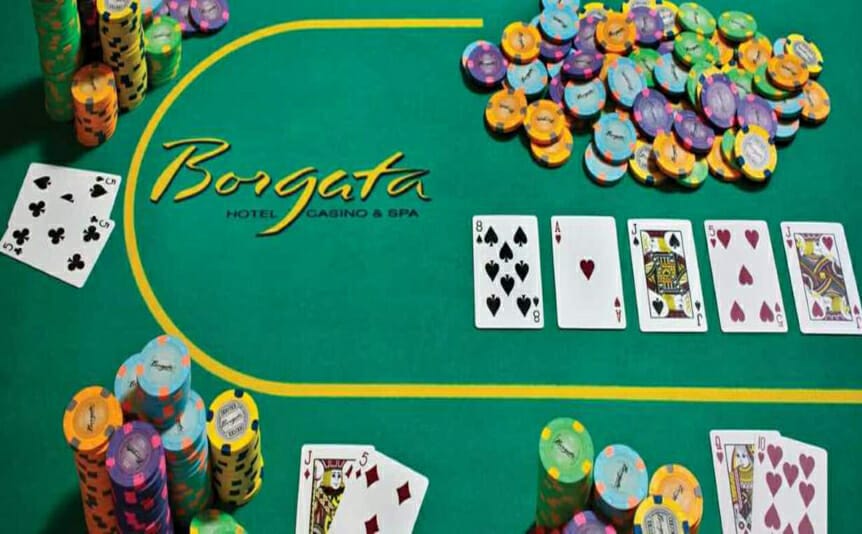 A poker table with cards and casino chips in the Borgata Poker Room at the Borgata Hotel Casino & Spa, Atlantic City, New Jersey.
