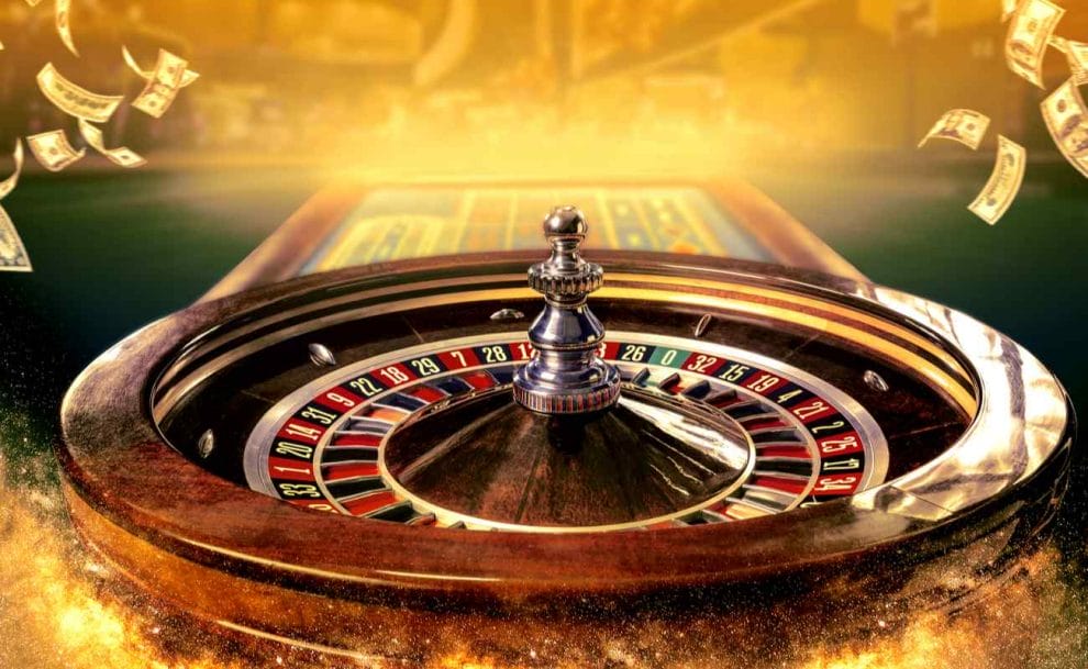Roulette table and wheel with money in the background.