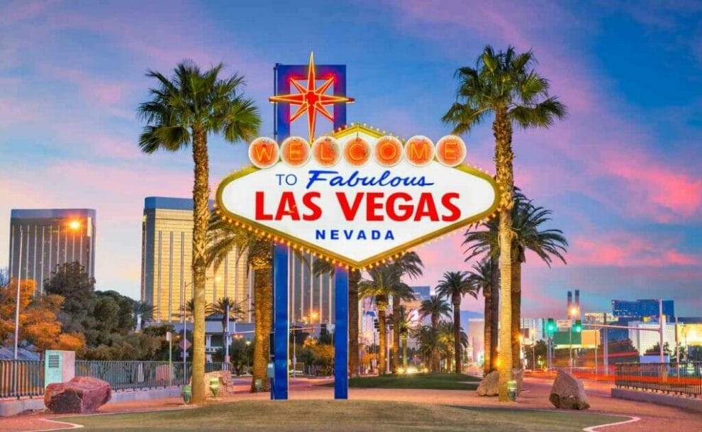 A ‘Welcome to Fabulous Las Vegas, Nevada’ sign with palm trees and buildings in the background.