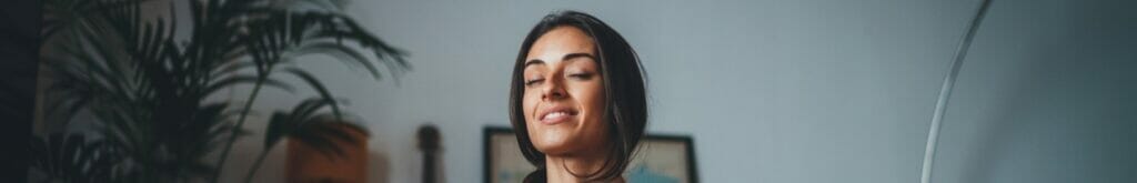 A woman practices meditation.