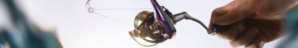 A close-up of a fishing reel.
