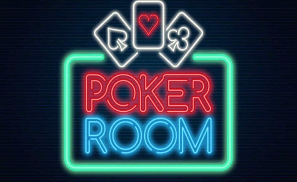 A red neon ‘poker’ sign on a wall.