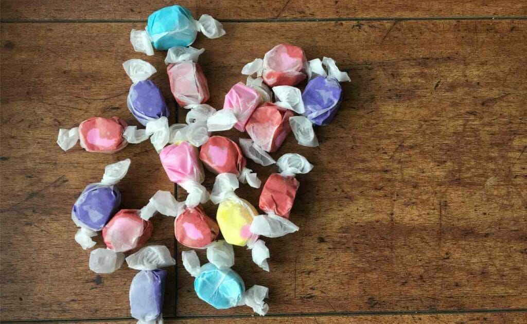 Salt water taffy on a wooden table.