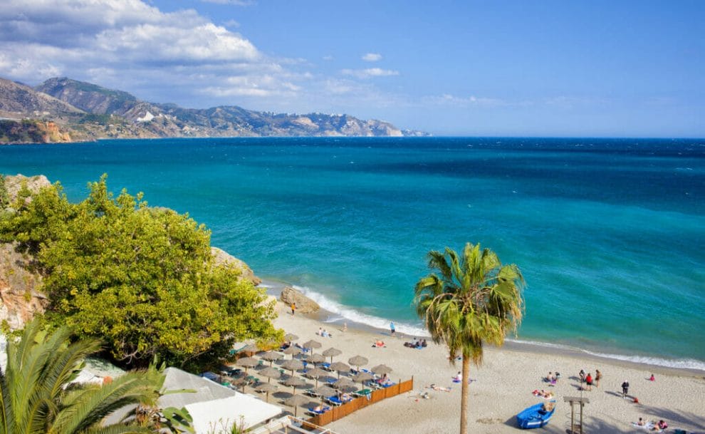 A view of the beach, sea and mountains at Nerja, Costa del Sol in Andalucia, Spain.