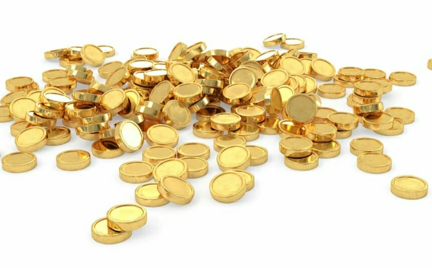 A heap of gold coins on a white surface.