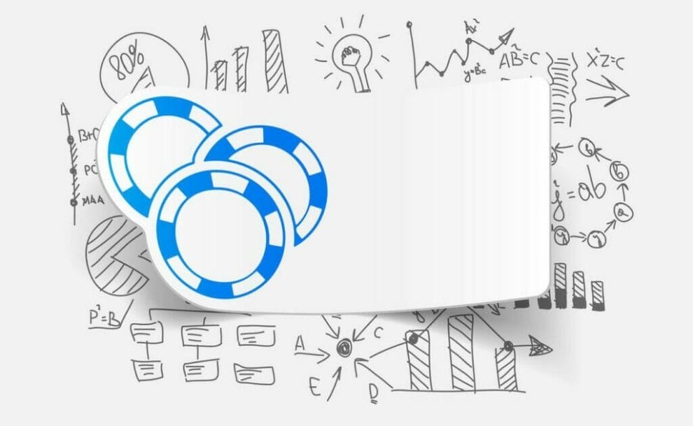 A printed image of poker chips on a piece of paper featured above mathematical equations and drawings.