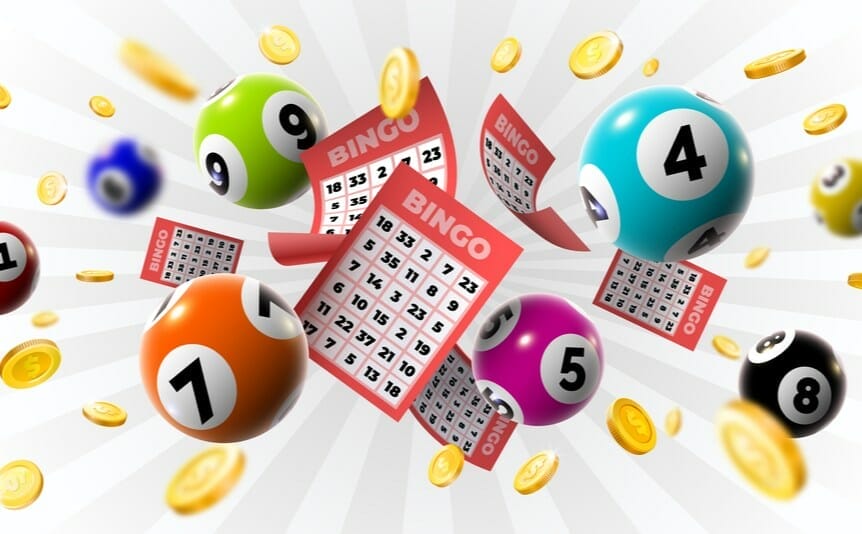 American bingo tickets surrounded by bingo balls and gold coins.
