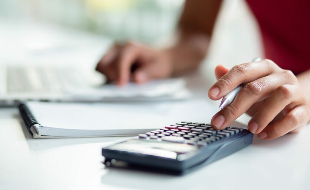 A person working on a calculator. 